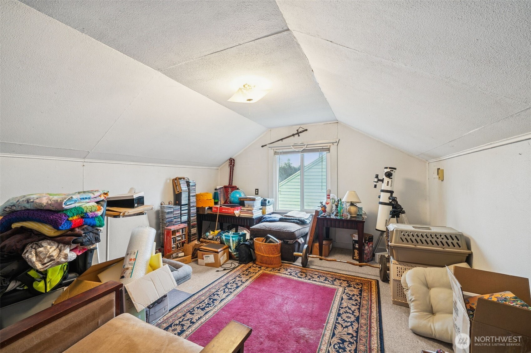 4912 South Prospect Street Tacoma, WA 98409 - Photo 10 of 16 a living room with furniture and a window