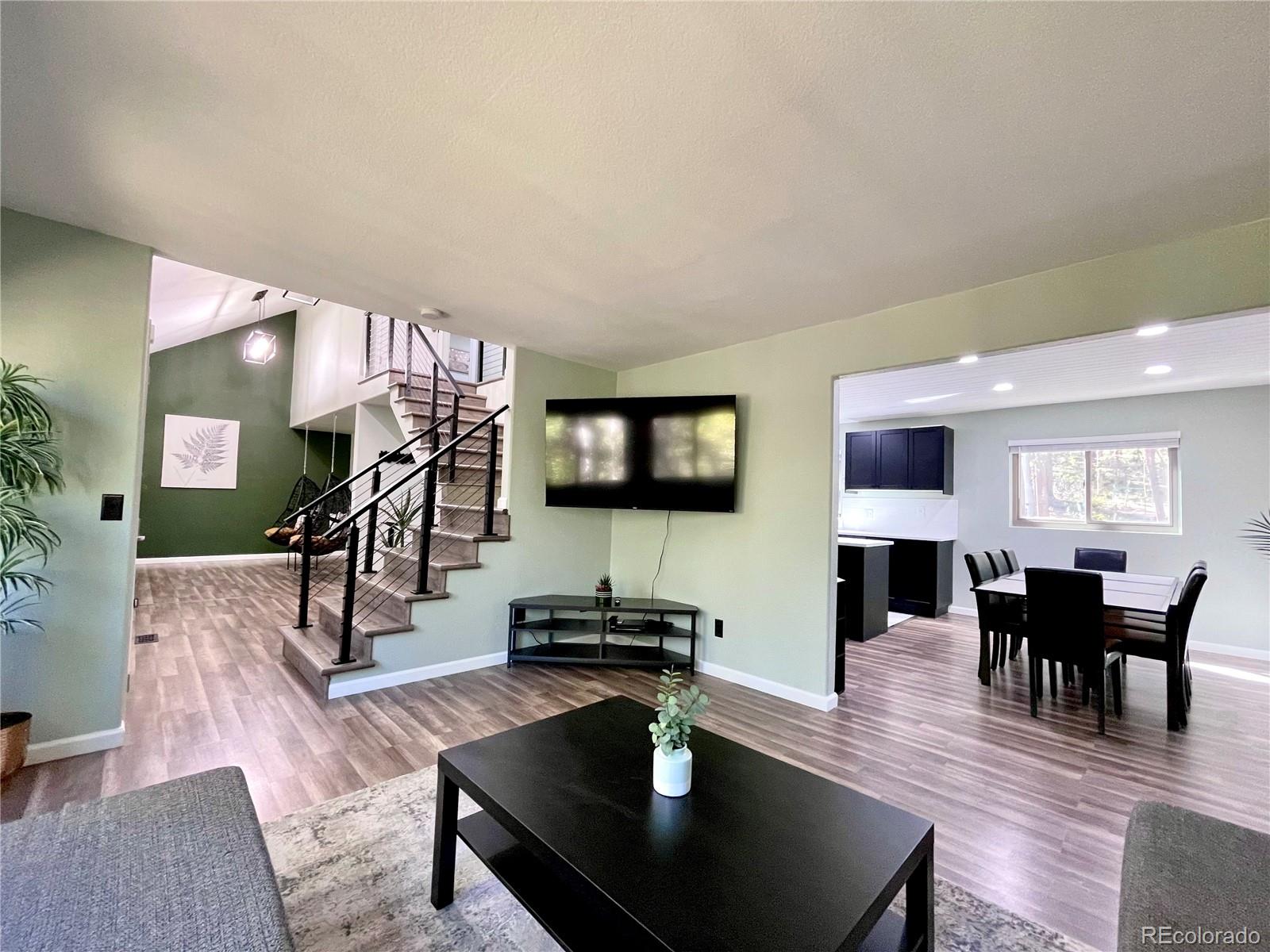 265 Caesar Road Black Hawk, CO 80422 - Photo 15 of 42 a living room with furniture and a flat screen tv