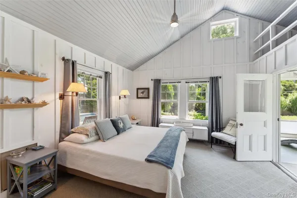 a bed room with a bed and a window