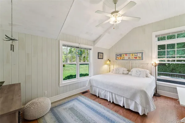 a bedroom with a large bed and a window