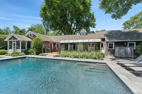 a front view of a house with swimming pool