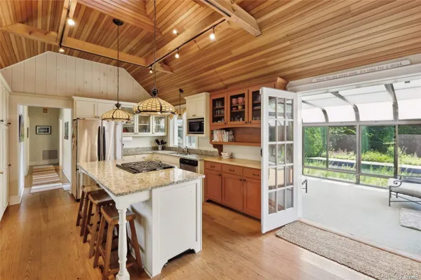 a open kitchen with stainless steel appliances granite countertop a stove and cabinets