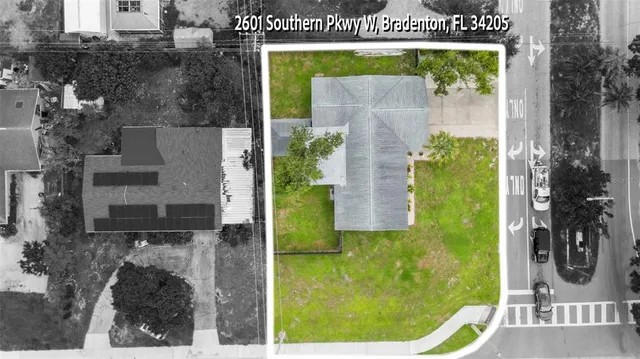 an aerial view of a house having yard