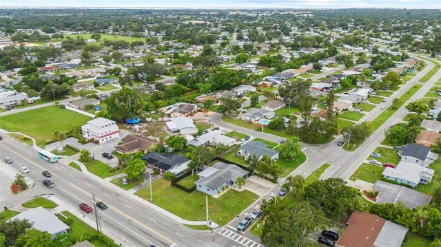 an aerial view of residential houses with outdoor space