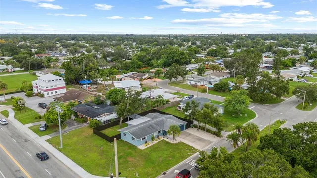 an aerial view of residential houses with outdoor space