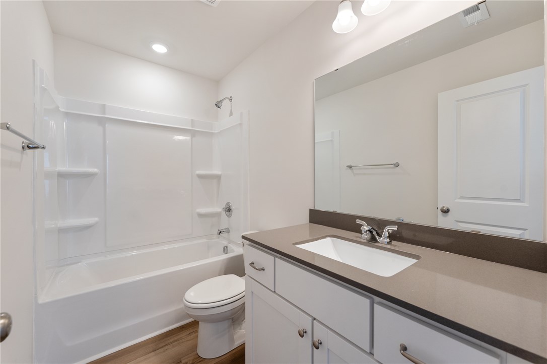 138 Cotesworth Street Pendleton, SC 29670 - Photo 11 of 19 This bathroom features a contemporary vanity with a sleek countertop and a spacious tub.