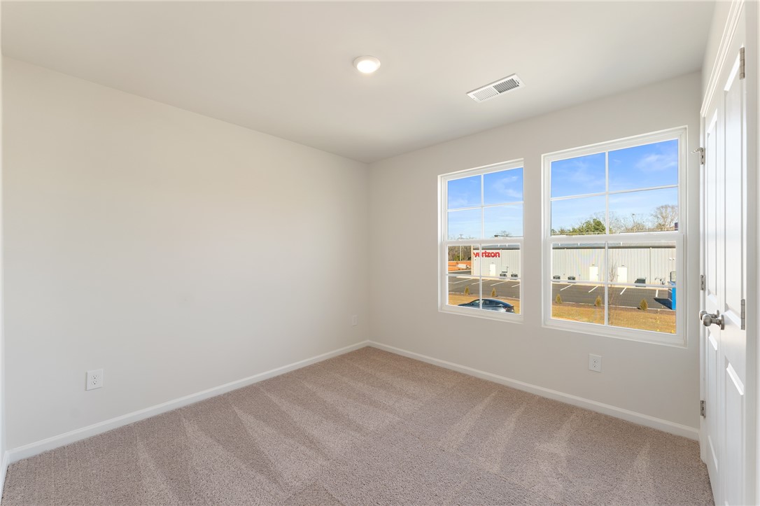 138 Cotesworth Street Pendleton, SC 29670 - Photo 14 of 19 This bright bedroom offers a neutral canvas, ready for personalized touches.
