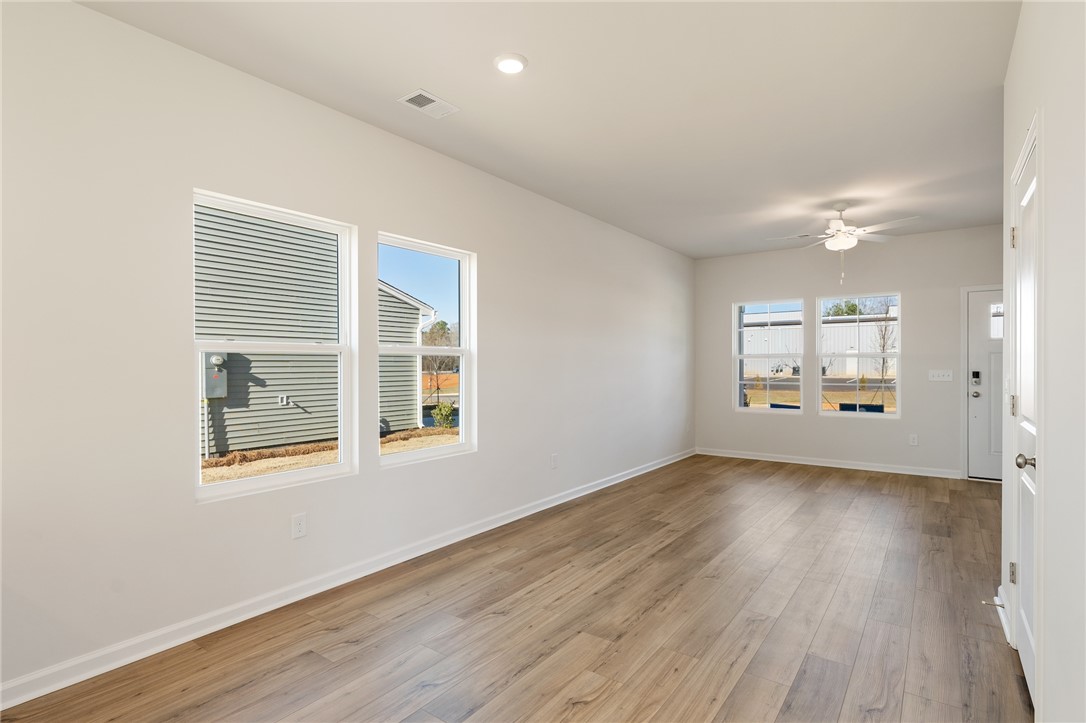 138 Cotesworth Street Pendleton, SC 29670 - Photo 5 of 19 This bright and airy room offers a welcoming atmosphere, perfect for everyday living.