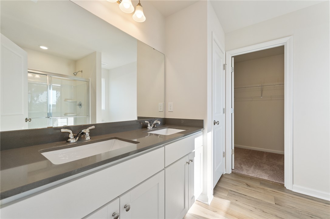 138 Cotesworth Street Pendleton, SC 29670 - Photo 10 of 19 This bright bathroom features dual vanities and modern finishes for comfortable living.