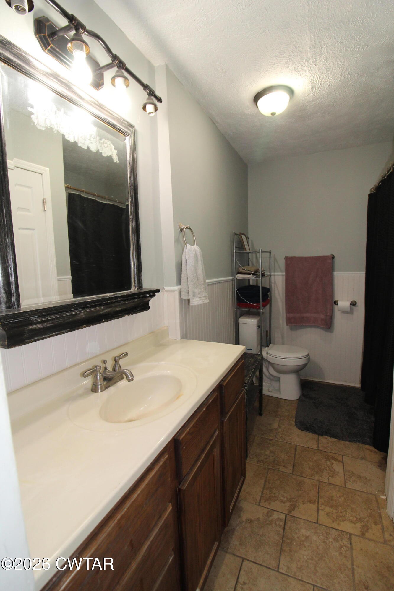 33 Kipling Drive Jackson, TN 38305 - Photo 14 of 20 a spacious bathroom with a sink a toilet and mirror