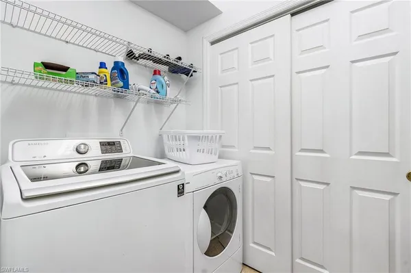 a utility room with dryer and washer