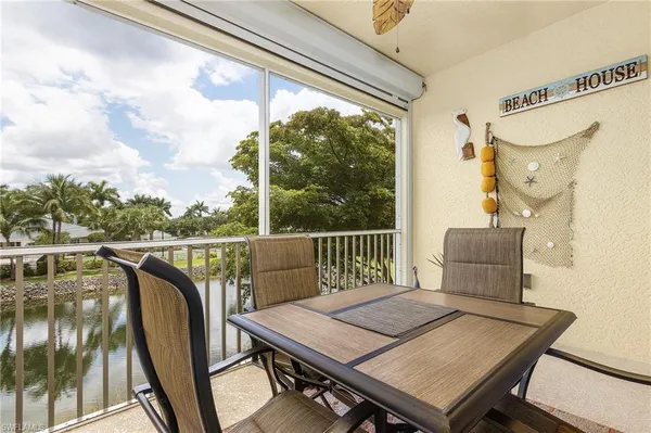 a view of a balcony with furniture