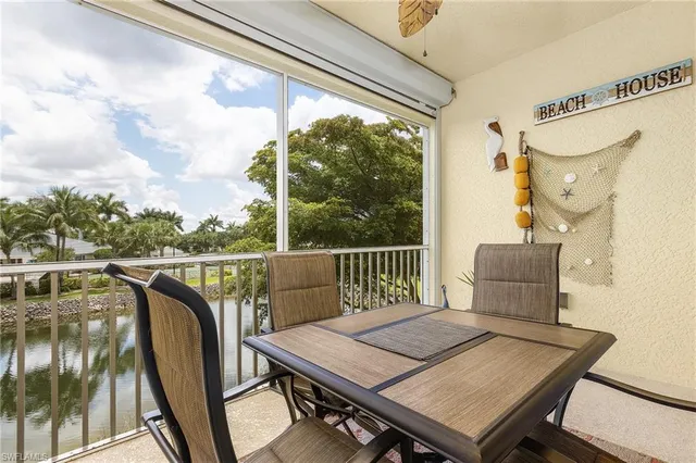 a view of a balcony with furniture