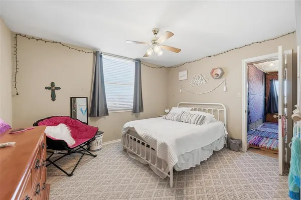 a bathroom with a sink and mirror with bathtub