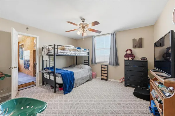 a balcony view with couch and chairs