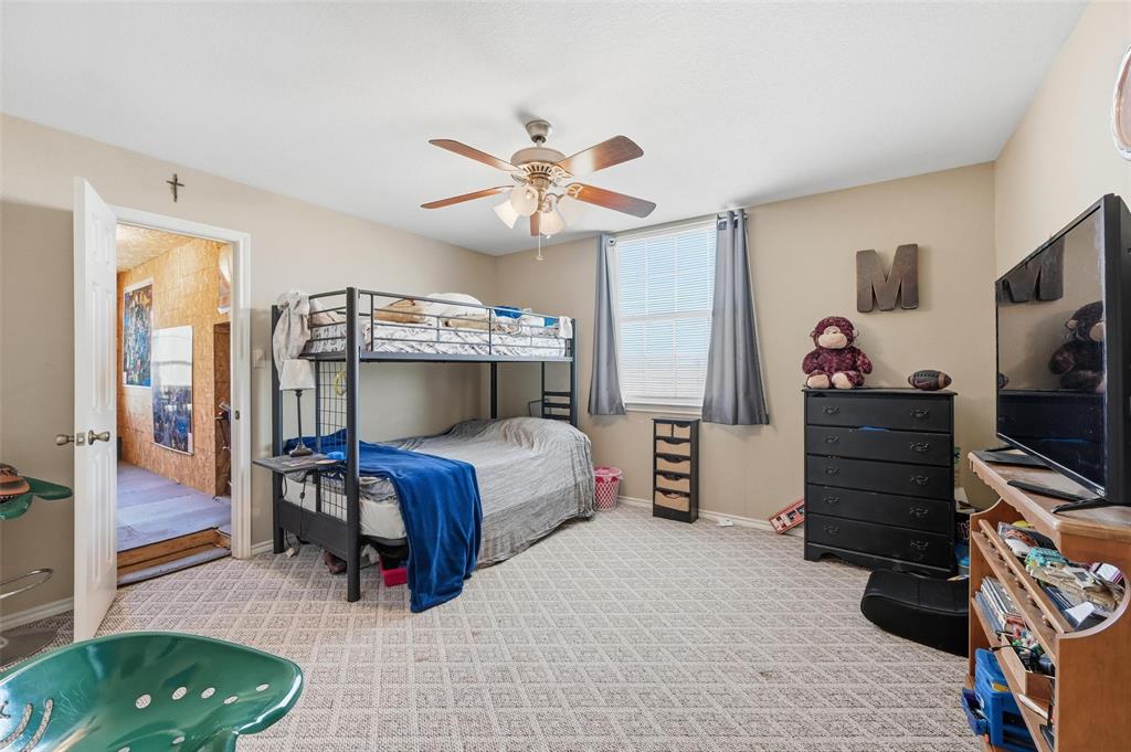 346 Forreston Road Waxahachie, TX 75165 - Photo 20 of 36 a bedroom with a bed and a dresser