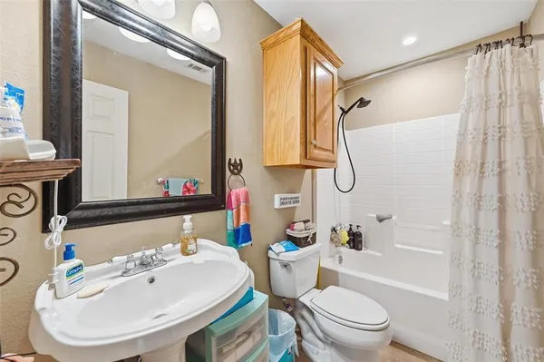 a view of a swimming pool with a lounge chair