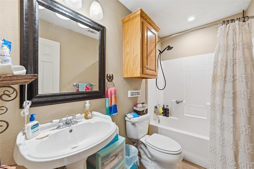 346 Forreston Road Waxahachie, TX 75165 - Photo 24 of 36 a bathroom with a sink a toilet and shower