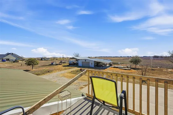 a view of house with outdoor space and sitting area