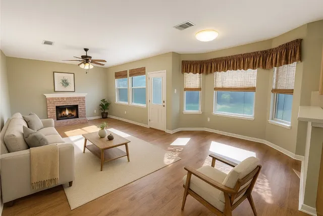 a living room with furniture and a fireplace