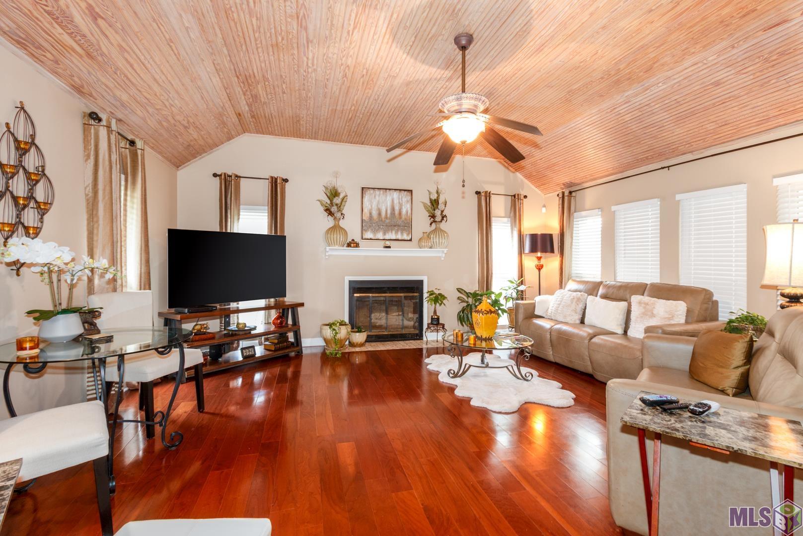 3142 Kings Canyon Drive Baton Rouge, LA 70814 - Photo 4 of 17 Family Room with Vaulted Bead Board Ceiling and Wood Burning Fireplace