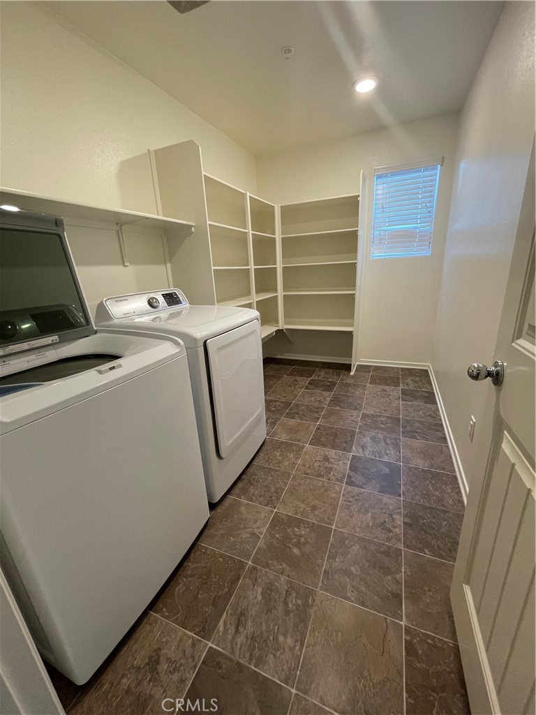 30433 Village Knoll Drive Menifee, CA 92584 - Photo 11 of 12 a room with a washing machine and cabinets