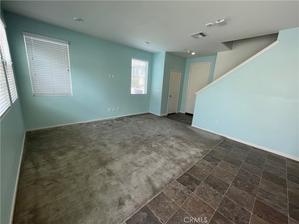 30433 Village Knoll Drive Menifee, CA 92584 - Photo 4 of 12 a view of an empty room with window and bathroom