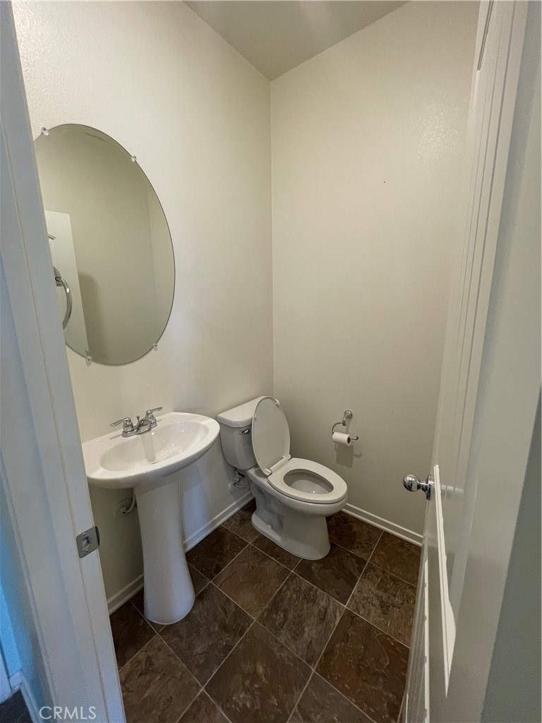30433 Village Knoll Drive Menifee, CA 92584 - Photo 5 of 12 a bathroom with a toilet and a sink