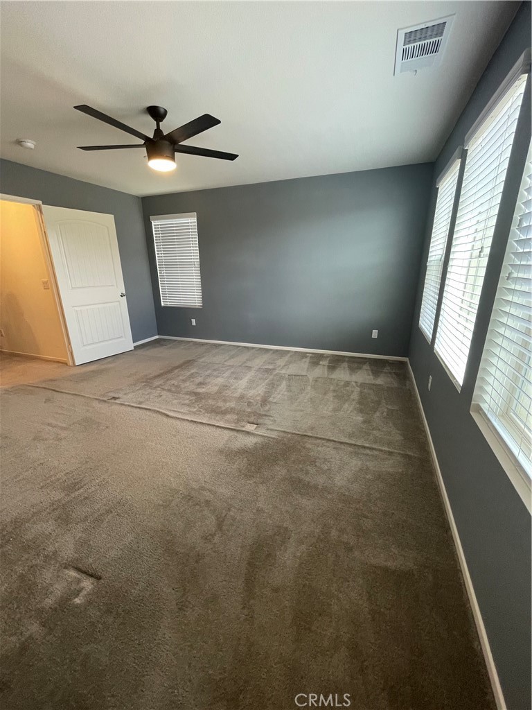30433 Village Knoll Drive Menifee, CA 92584 - Photo 10 of 12 a view of an empty room and window