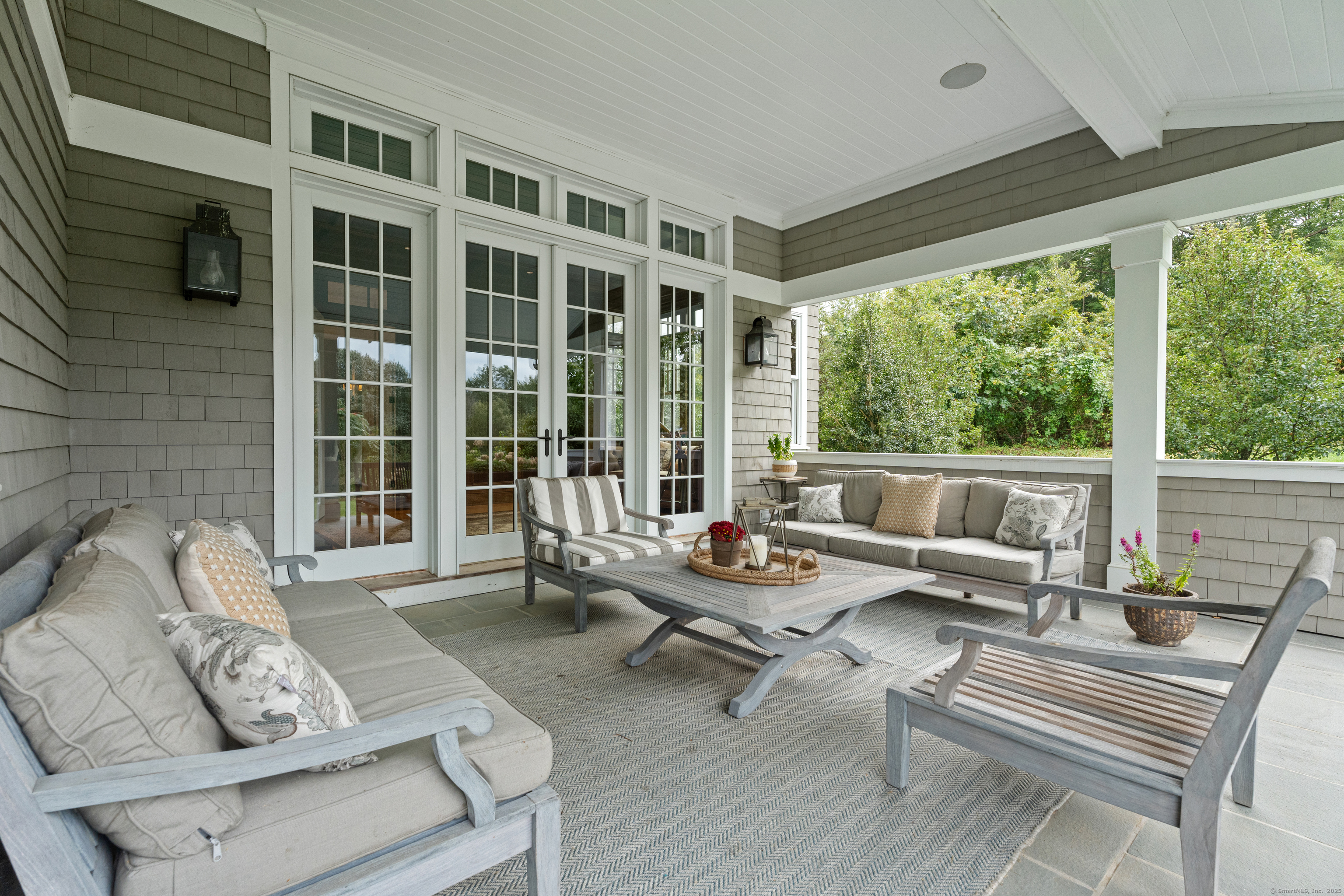 294 Maple Road Easton, CT 06612 - Photo 33 of 40 One of several covered patios, just outside the office, overlooks the serene backyard oasis-perfect for relaxing or entertaining.