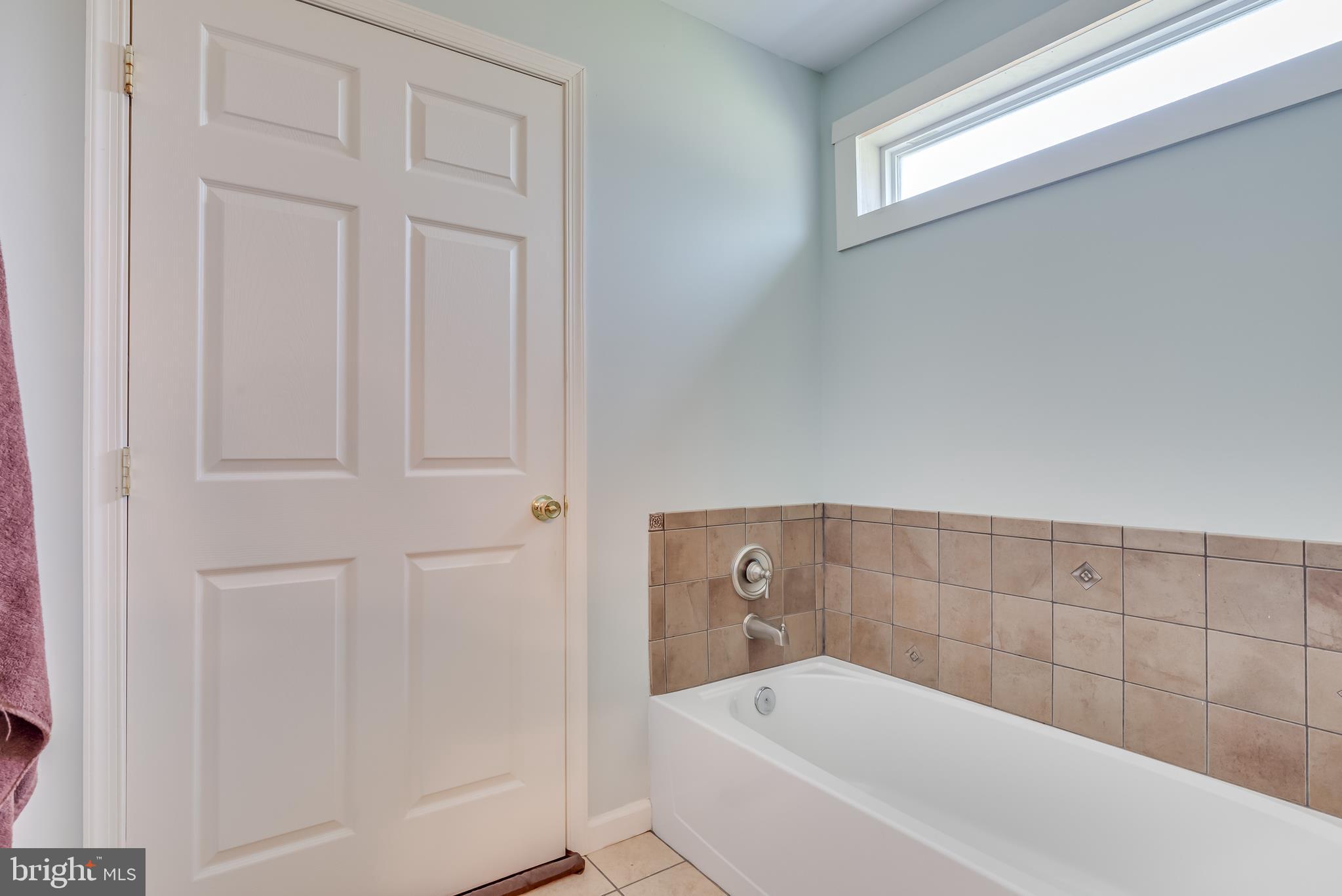 1268 Duckwall Road Berkeley Springs, WV 25411 - Photo 24 of 71 Bathtub is encased in a decorative tile