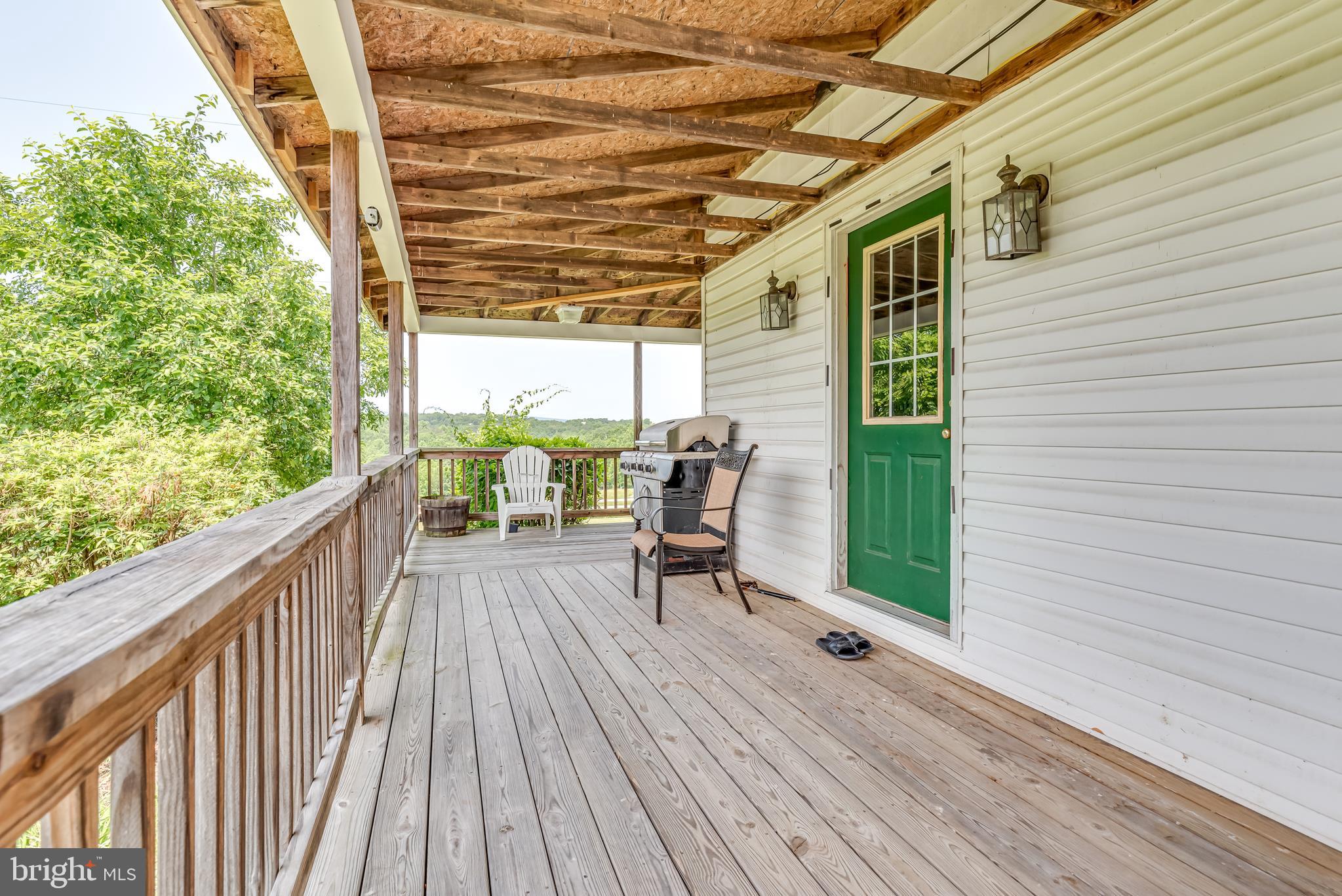 1268 Duckwall Road Berkeley Springs, WV 25411 - Photo 35 of 71 Outside there is a wrap around porch that is fully