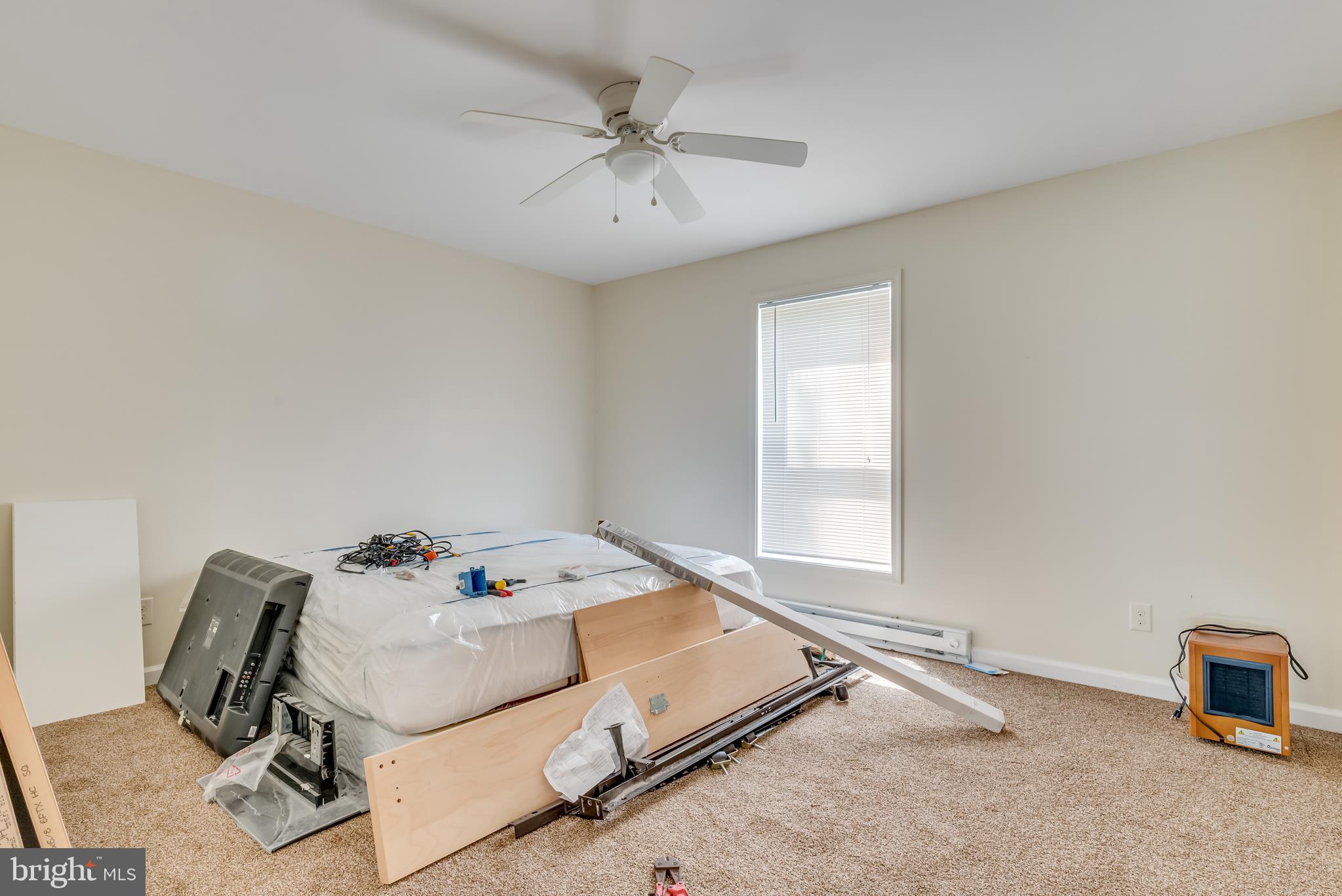 1268 Duckwall Road Berkeley Springs, WV 25411 - Photo 50 of 71 Bedroom 1 - neutral paint, carpet, and ceiling fan