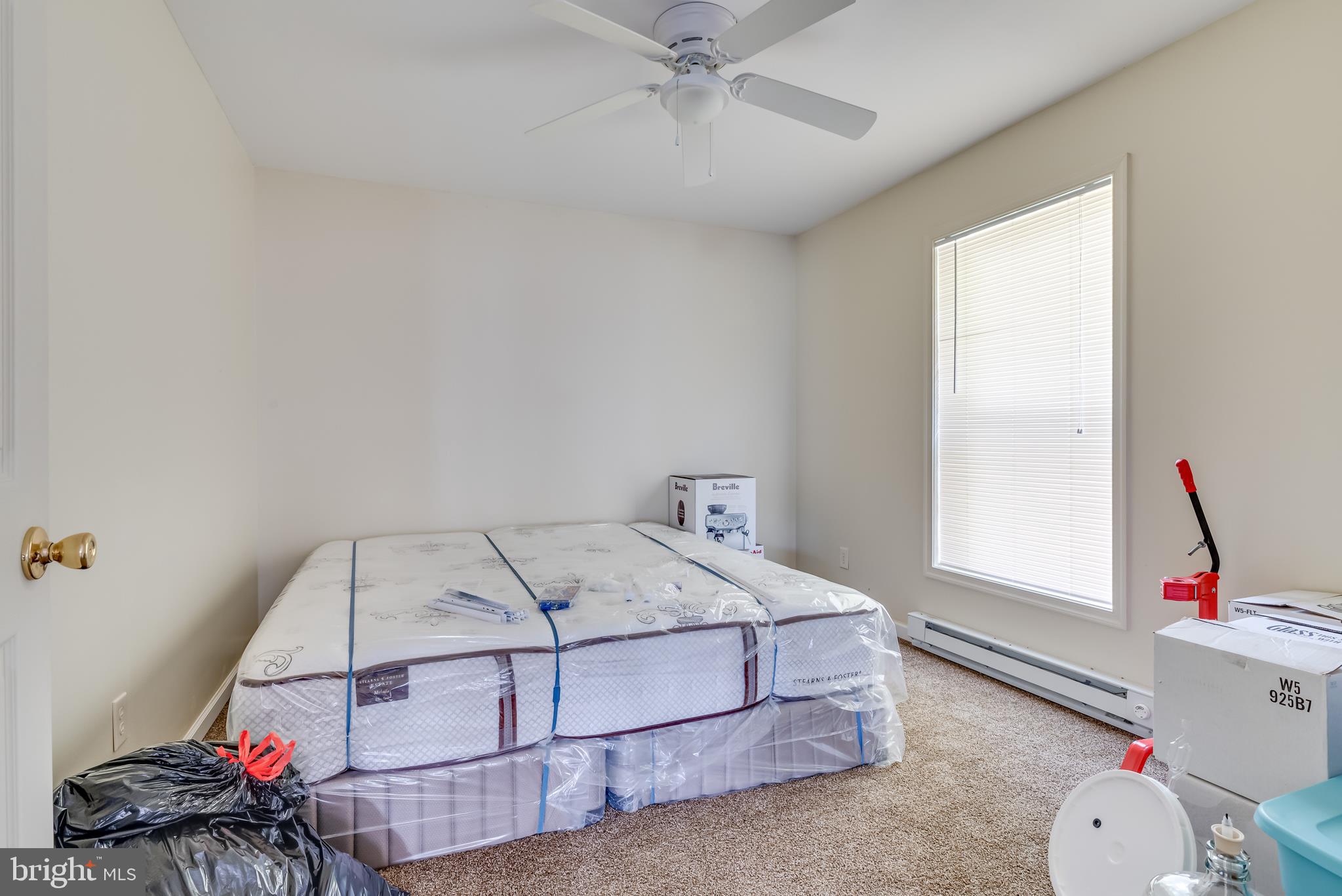 1268 Duckwall Road Berkeley Springs, WV 25411 - Photo 51 of 71 Bedroom 2 - neutral paint, carpet, and ceiling fan