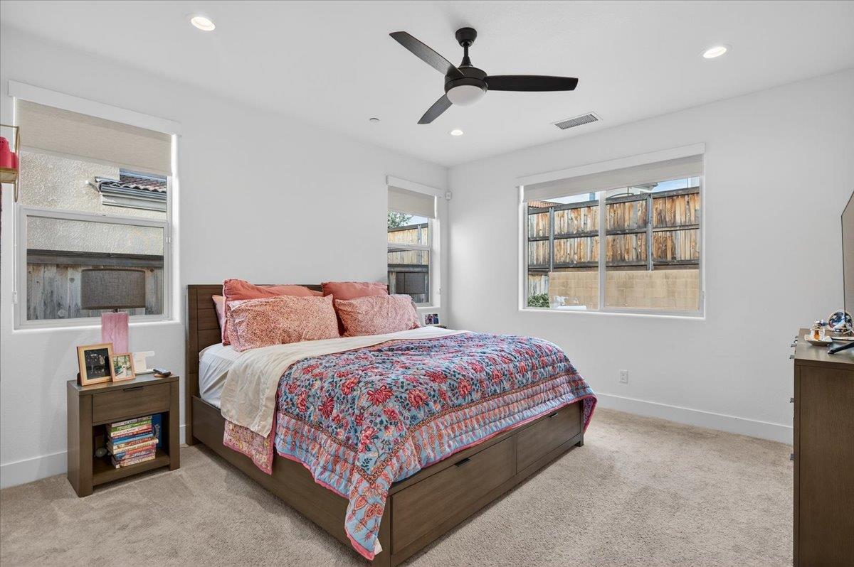 4593 Orchard Hills Road Madera, CA 93636 - Photo 16 of 25 a bedroom with a bed and a window