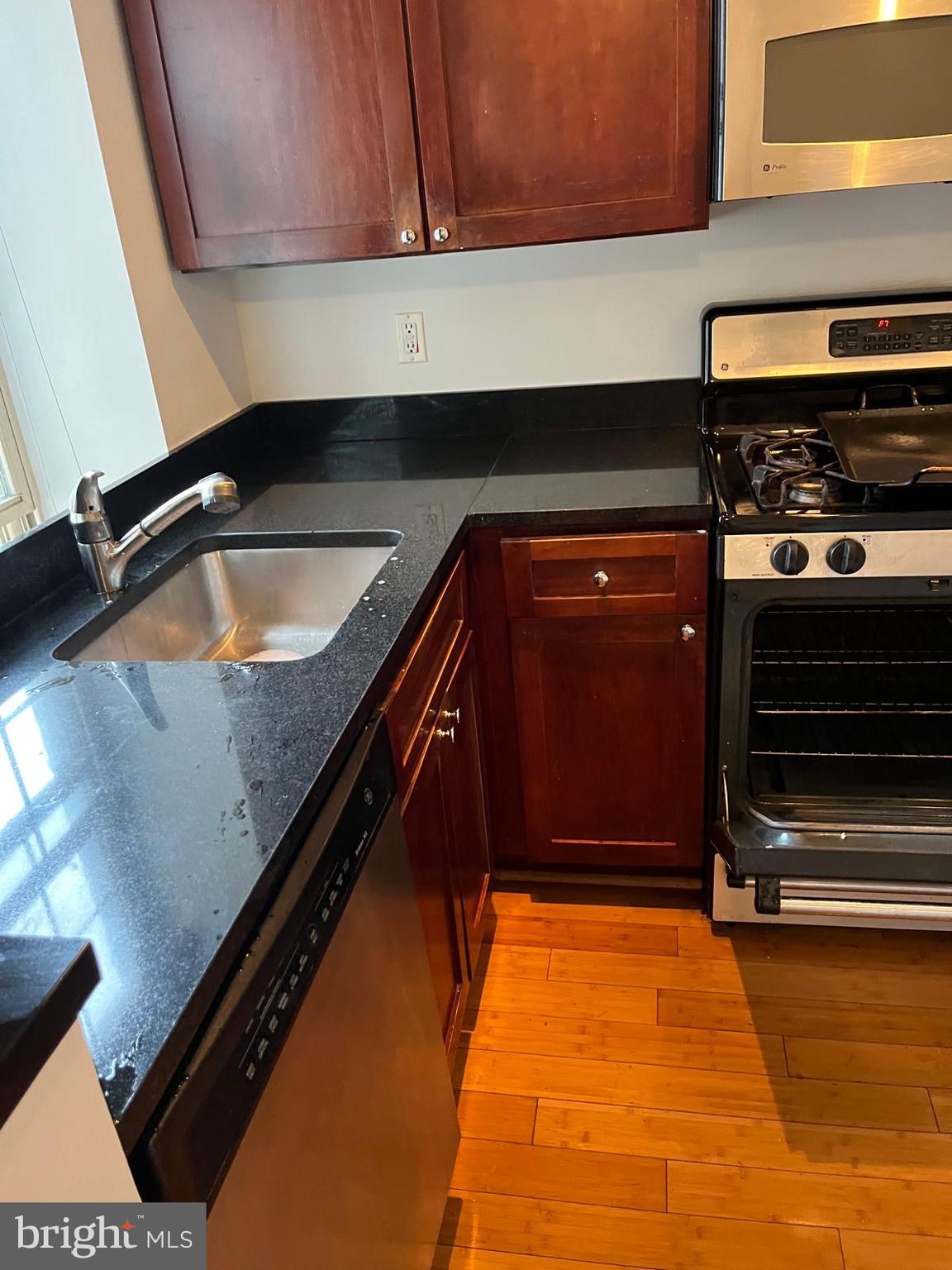 1417 Newton Street Northwest, Unit 204 Washington, DC 20010 - Photo 5 of 11 a kitchen with sink and cabinets