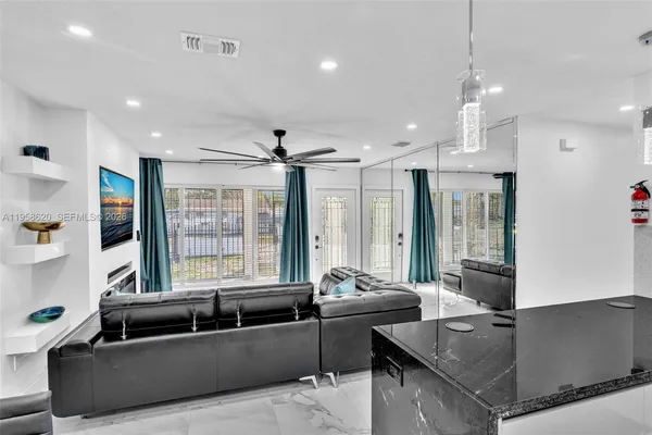 a living room with furniture and a large window