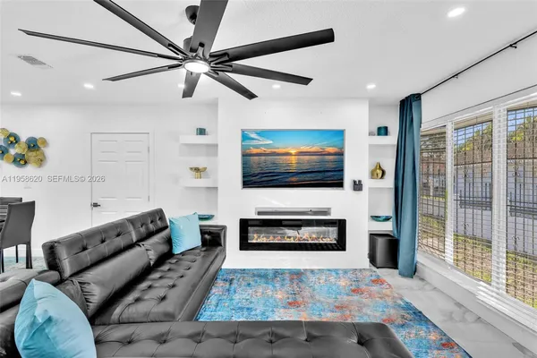 a living room with furniture and a flat screen tv