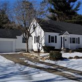 a front view of a house with yard