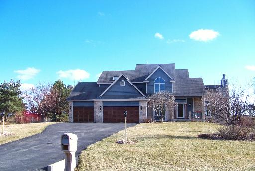 1717 Elm Street Spring Grove, IL 60081 - Photo 1 of 1 a front view of a house with a yard