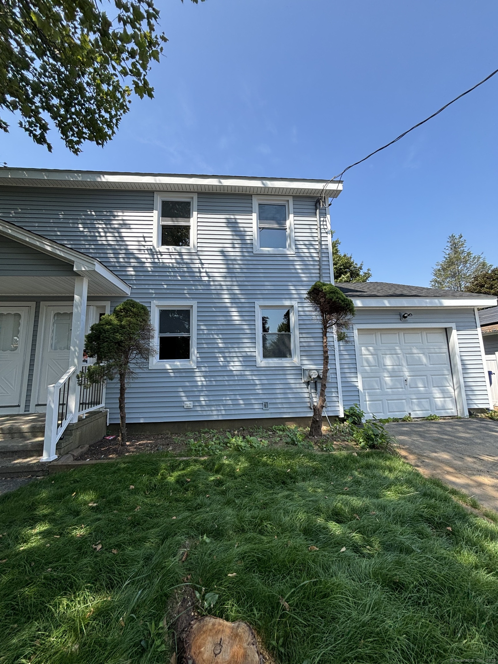 337 Wiklund Avenue Stratford, CT 06614 - Photo 1 of 1 front view of a house with a yard