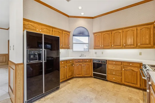 a kitchen with stainless steel appliances granite countertop a stove and a sink