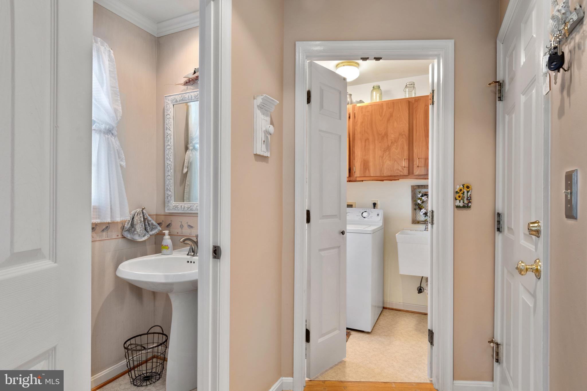 903 Long Point Road Grasonville, MD 21638 - Photo 29 of 68 Half Bath and Laundry Room leads to Garage