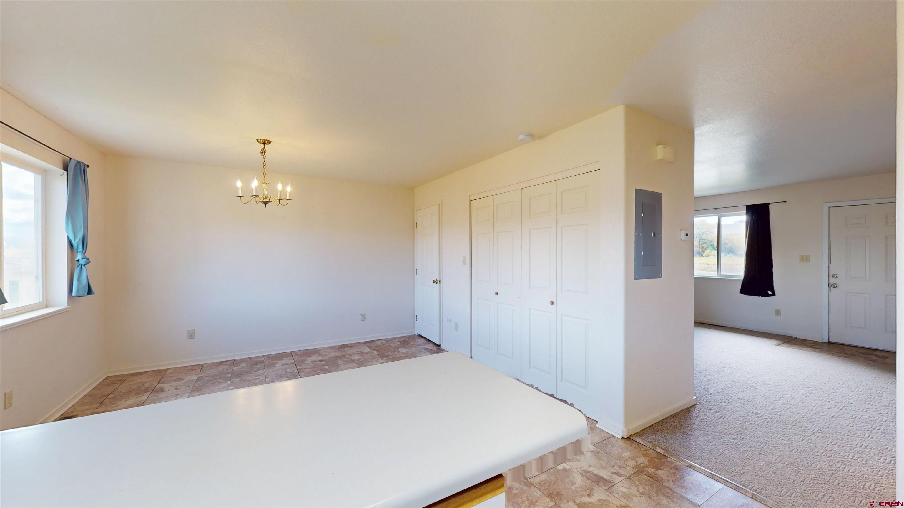 314 South 5th Street Gunnison, CO 81230 - Photo 12 of 26 wooden floor in an empty room with a window