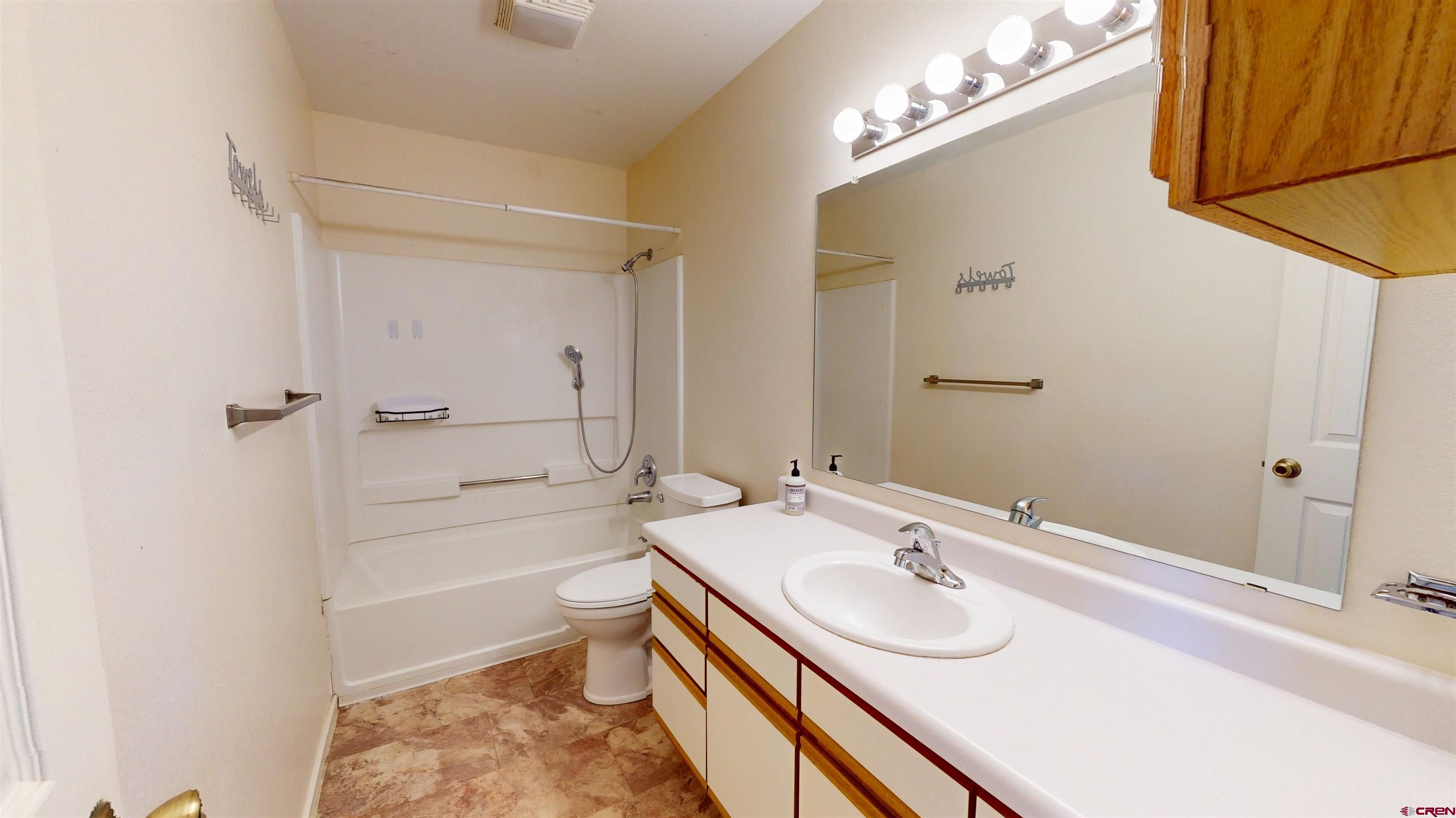314 South 5th Street Gunnison, CO 81230 - Photo 16 of 26 a bathroom with a sink a toilet and shower
