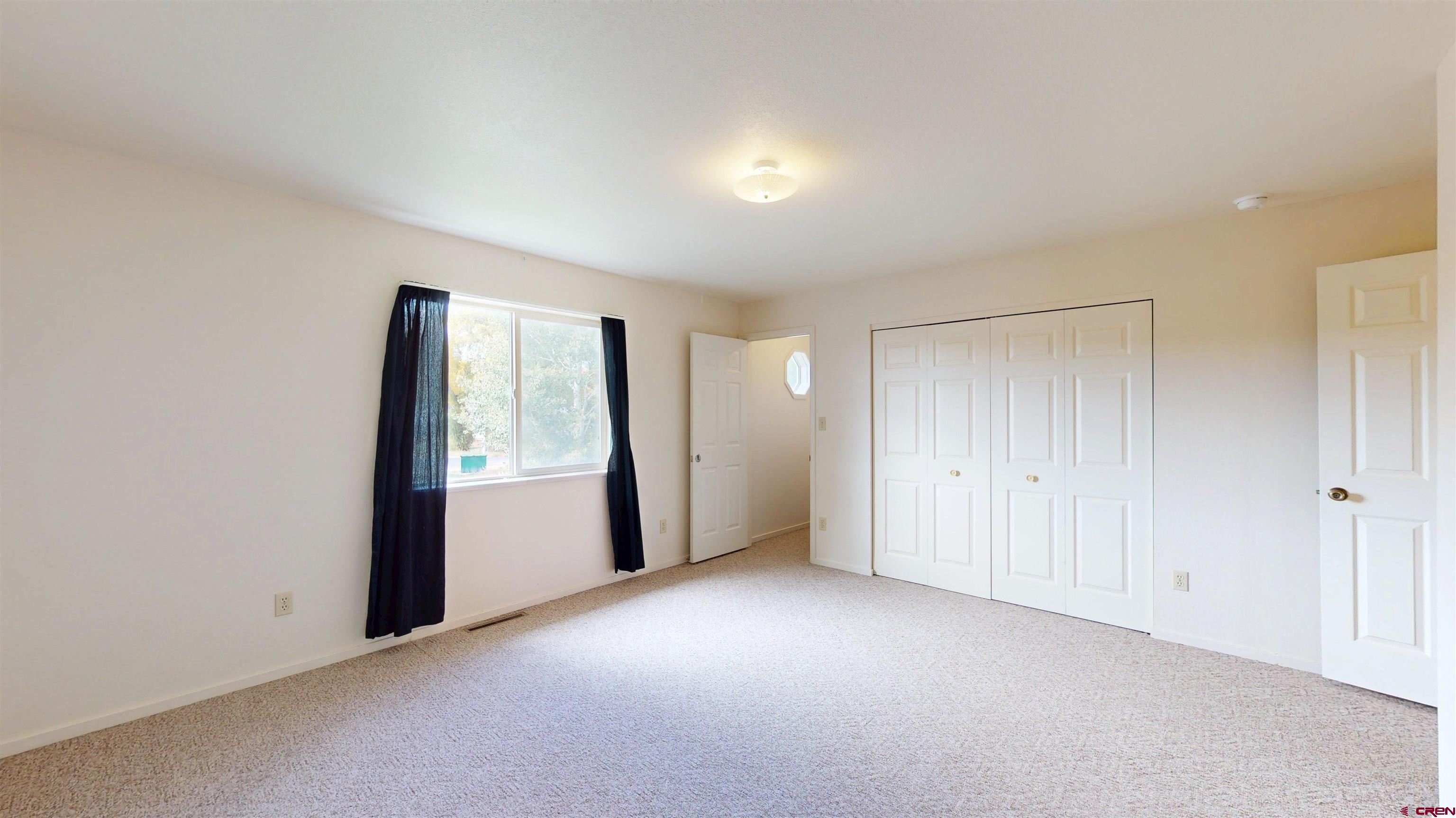 314 South 5th Street Gunnison, CO 81230 - Photo 23 of 26 a view of an empty room with a window