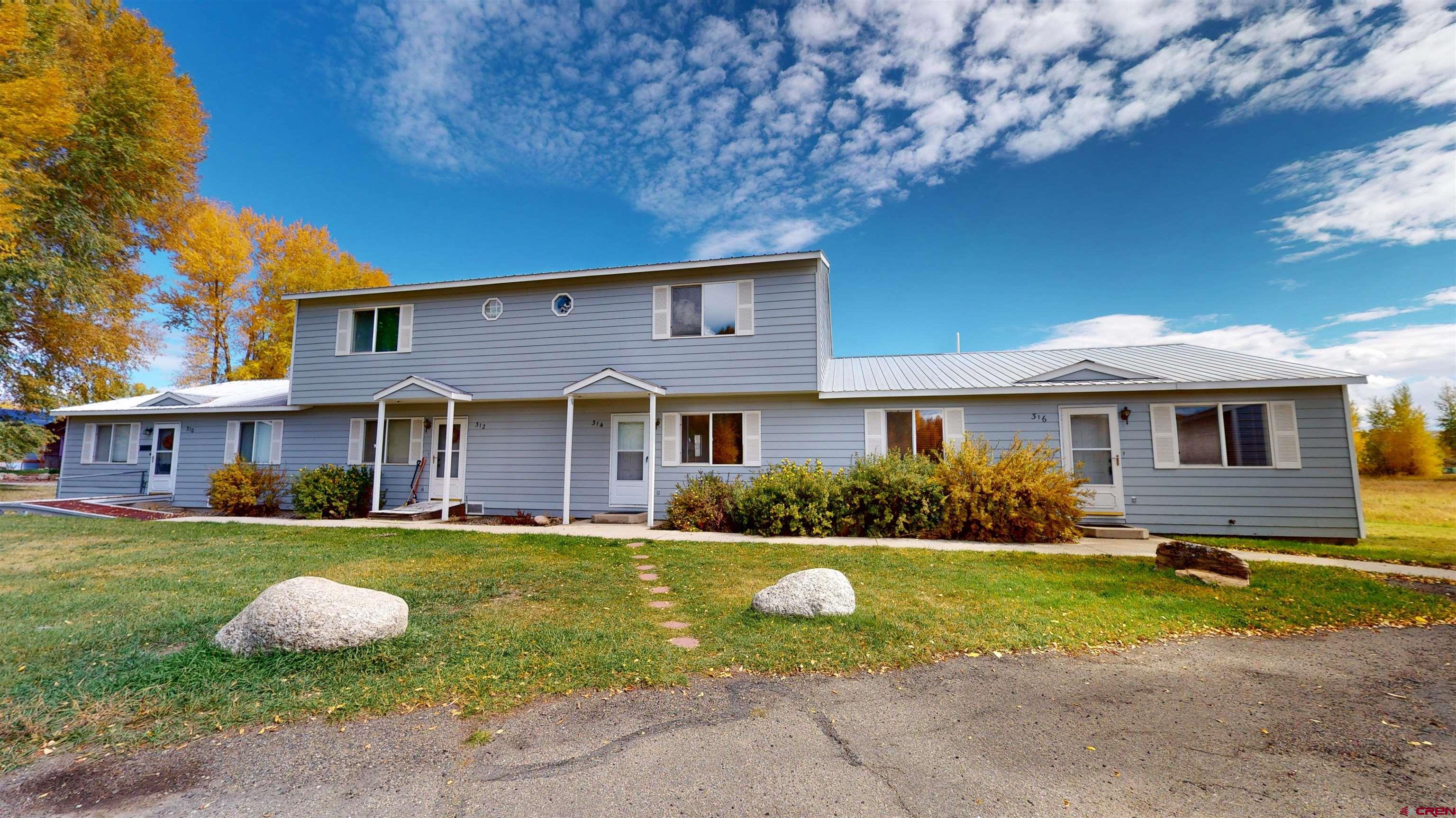 314 South 5th Street Gunnison, CO 81230 - Photo 4 of 26 a front view of a house with garden