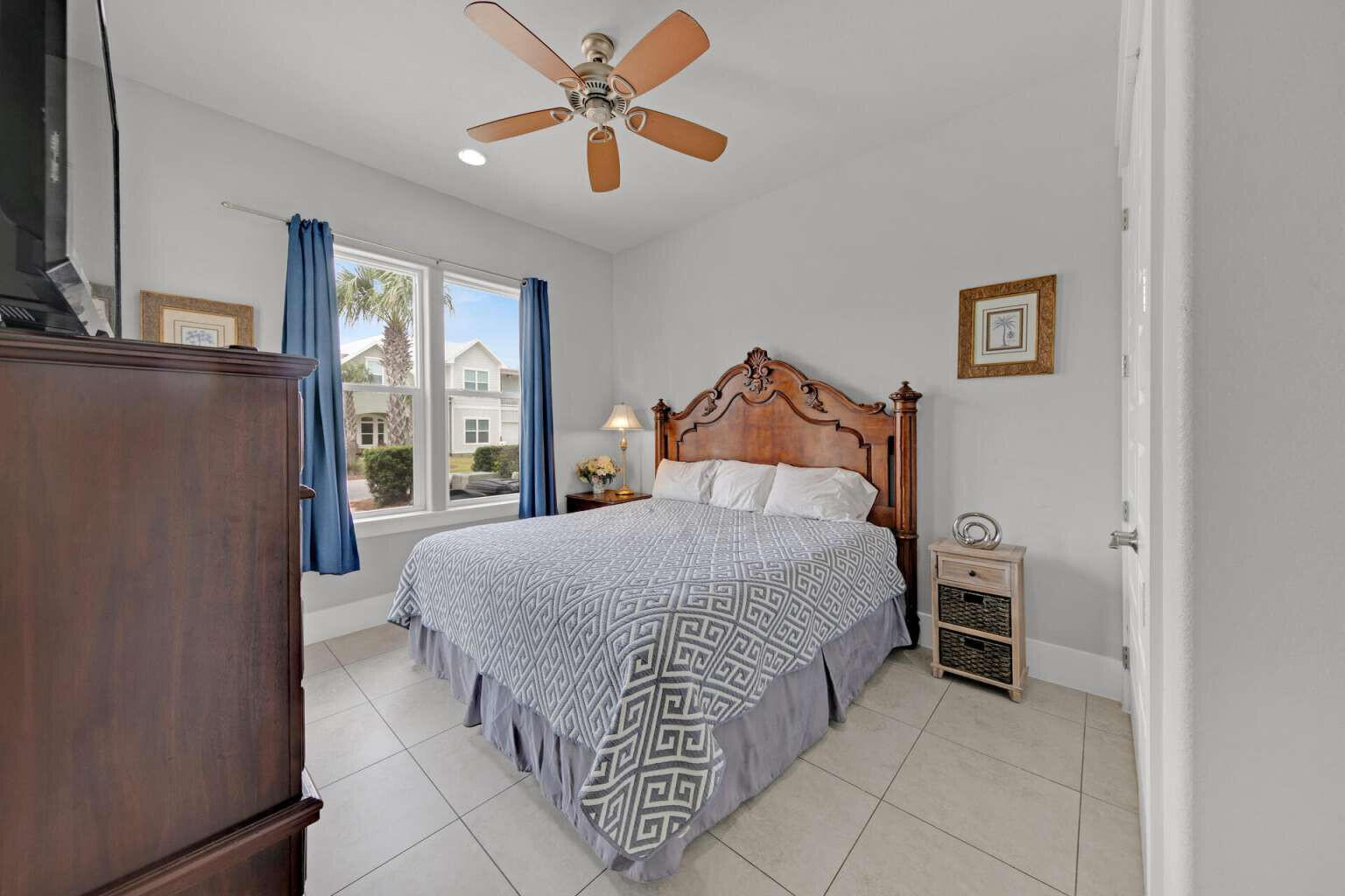 228 Miami Street Miramar Beach, FL 32550 - Photo 13 of 20 a bedroom with a bed and a chandelier