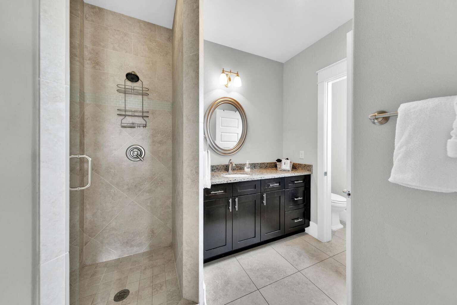 228 Miami Street Miramar Beach, FL 32550 - Photo 14 of 20 a bathroom with a double vanity sink mirror and shower