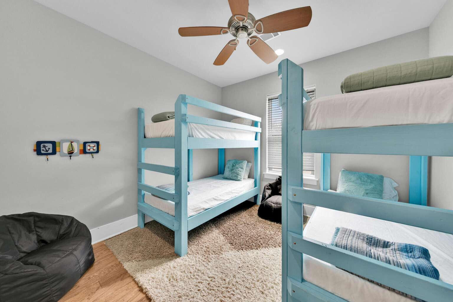 228 Miami Street Miramar Beach, FL 32550 - Photo 15 of 20 a bedroom with a bed a mirror and lamp